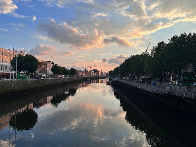 Sunset reflecting over a canal in a city